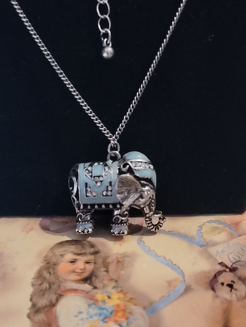 Silver Elephant Pendant Necklace with Light Blue Enamel